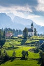 Church Cerkev Sveti Duh with mountain range KamnikÃ¢â¬âSavinja Alps Royalty Free Stock Photo